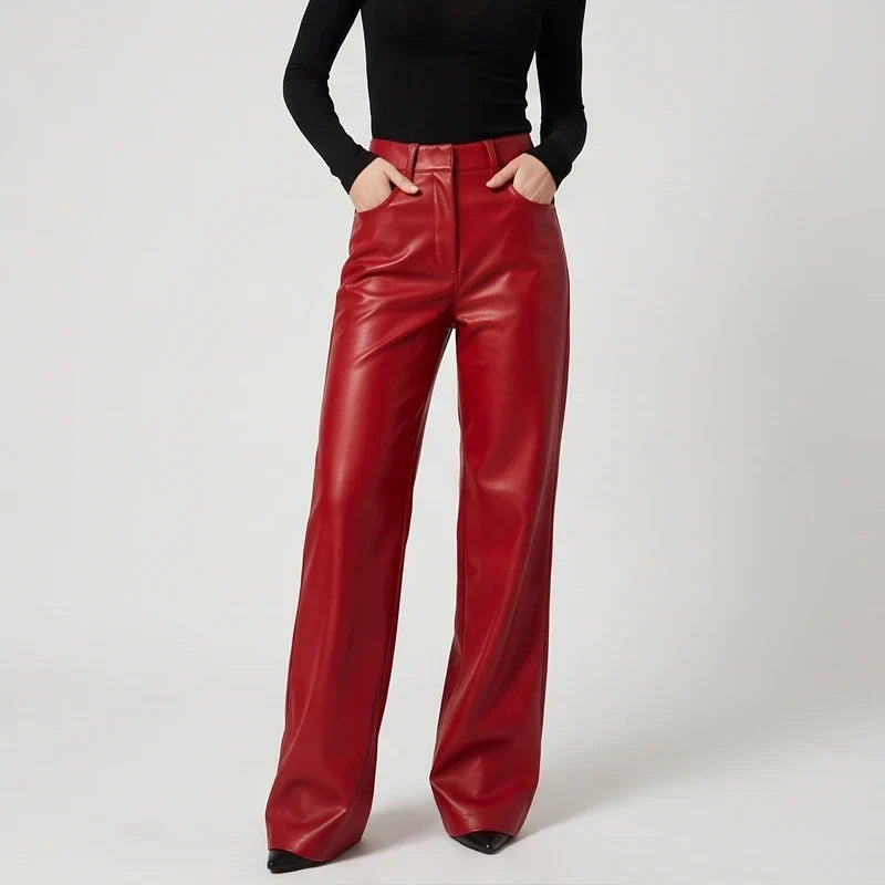 Red leather pants on an off-gray studio background