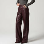 Brown leather pants on an off-gray studio background - 2
