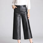 Black leather pants on an off-gray studio background - 2