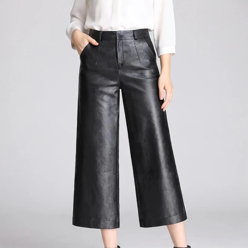 Black leather pants on an off-gray studio background - 2
