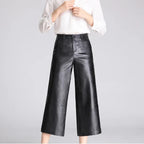 Black leather pants on an off-gray studio background - 3