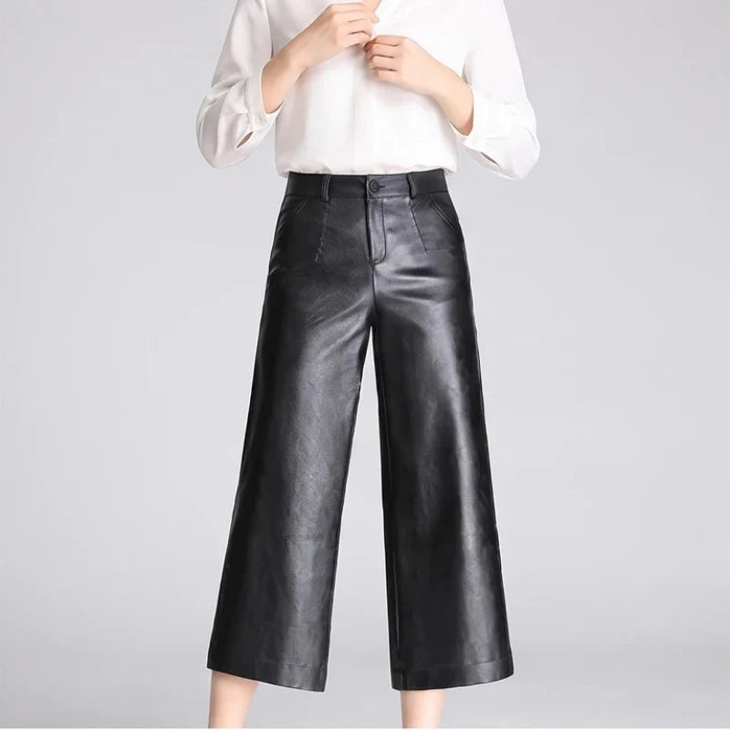 Black leather pants on an off-gray studio background - 3