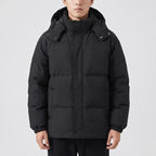 Black cotton jackets in a dark wood interior