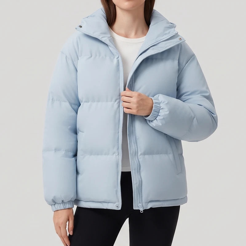 Light Blue jacket on an off-gray studio background