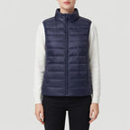 Blue cotton vest on an off-gray studio background