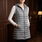 Gray vest in a dark wood interior