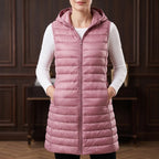 Pink vest in a dark wood interior