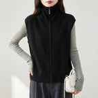 Black wool vest on an off-gray studio background