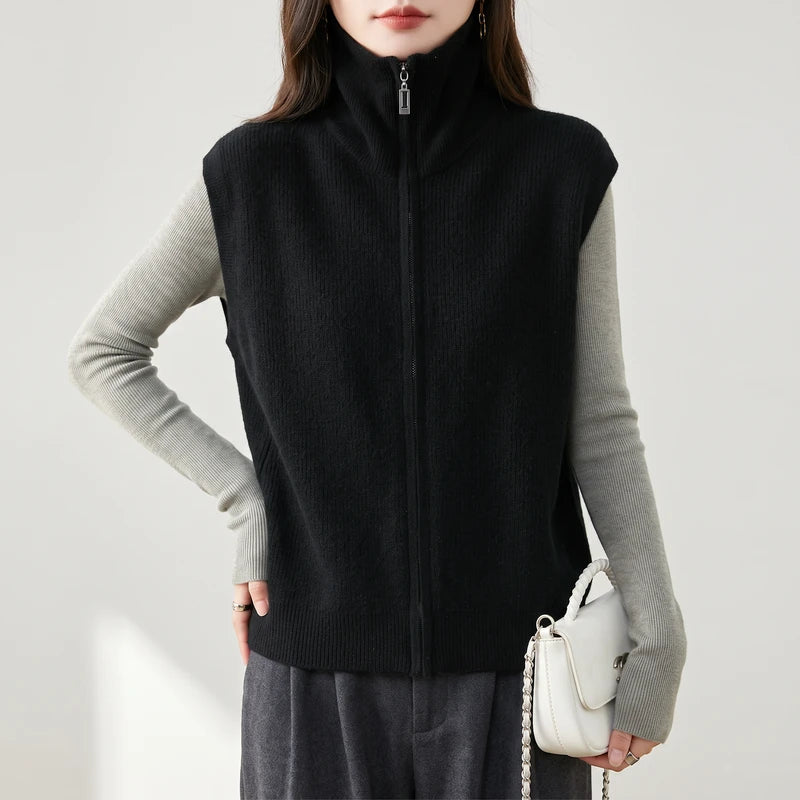 Black wool vest on an off-gray studio background