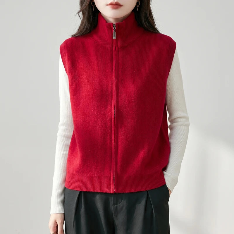 Red wool vest on an off-gray studio background