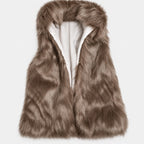 Taupe faux fur vest with a soft, shaggy texture and a white inner lining, laid flat.