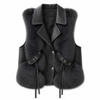 Black vest with dark grey fur panels, black faux leather lapels, and side ties with silver grommets, shown flat lay.