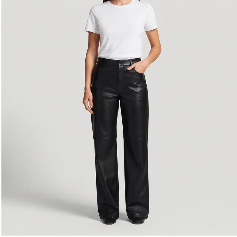 Black leather pants on an off-gray studio background