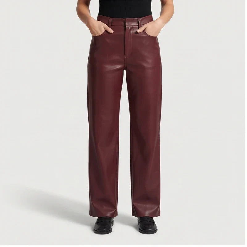 wine red leather pants on an off-gray studio background