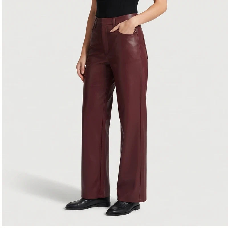 wine red leather pants on an off-gray studio background - 2