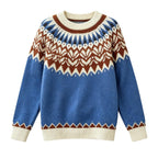 Flat lay of a blue, cream, brown, and black knit jumper with a detailed Nordic geometric pattern across the chest and shoulders.