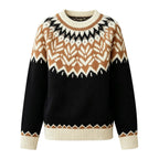 Flat lay of a black, cream, and brown knit jumper with a Fair Isle pattern on the yoke and ribbed cuffs.