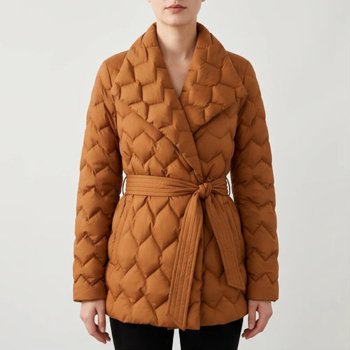 Woman wearing a waist-length, warm brown quilted puffer coat with a wide collar and a self-tie belt knotted at the waist.