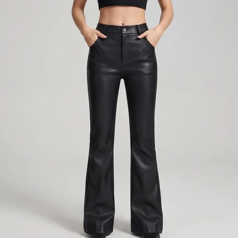 Black leather pants on an off-gray studio background